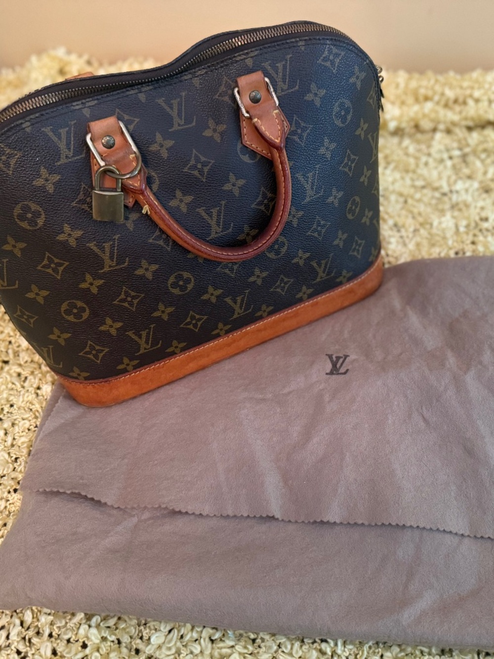 Lous Vuitton Alma bb bag with lock